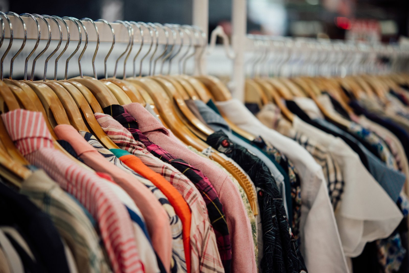 Clothing displayed on hangers in a fashion shop